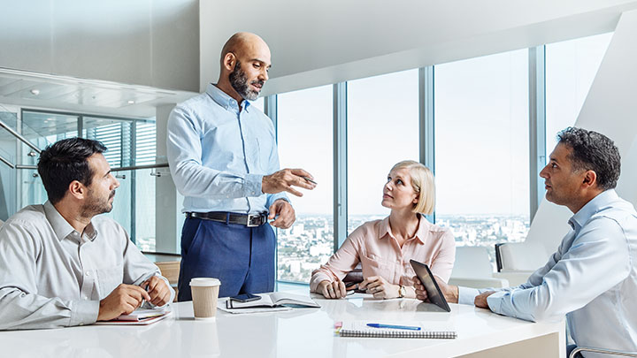 Colleagues having a meeting in office