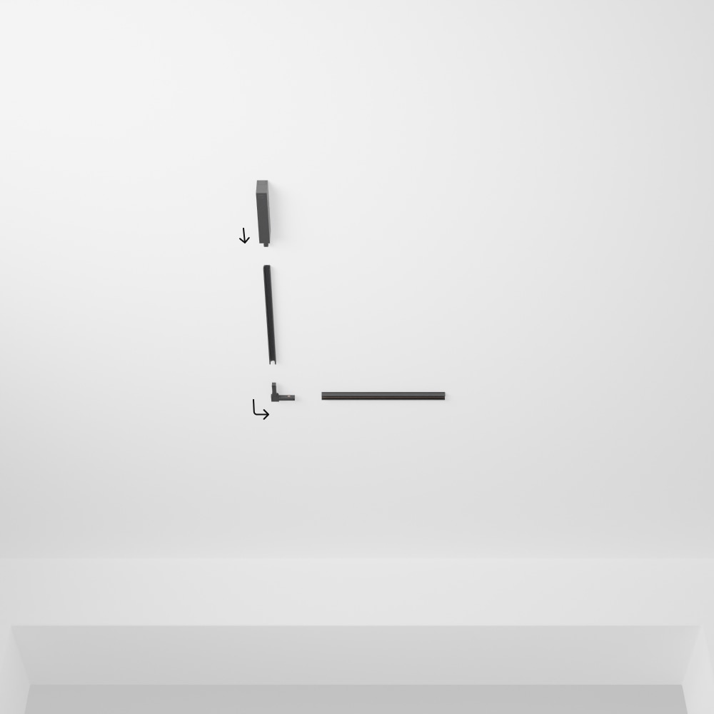 Black Perifo L-shape track lighting components with matte finish are arranged on a white ceiling, showing assembly direction arrows.