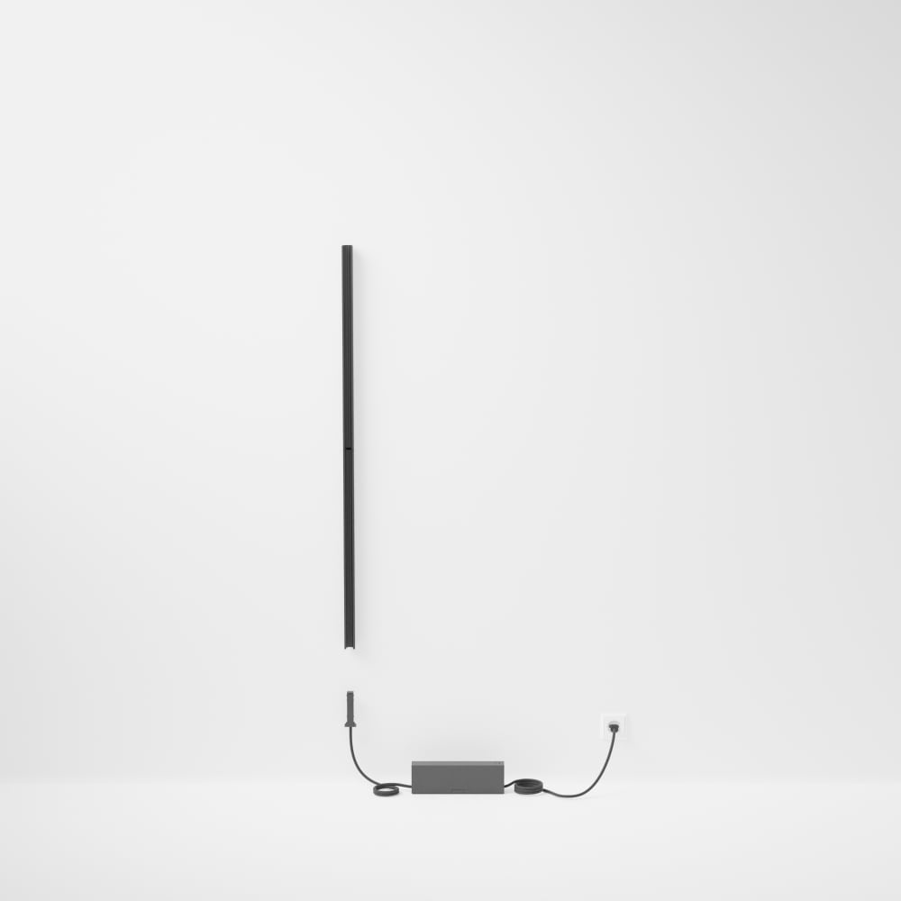 Straight black Perifo track lighting system with a matte finish, wall-mounted, featuring a compact power unit and visible cables.