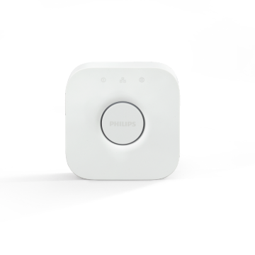 Primer plano de un puente Philips Hue Bridge sobre fondo blanco